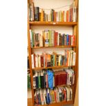 Five shelves of books, including Benson Hedges Racing Year, AA No Through Road, You and Your Rights,