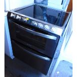 A Candy cooker, with halogen hob, top oven with grill and bottom oven.