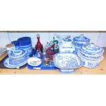 A large quantity of Willow pattern ceramics, including two tureens with covers, large bowl, biscuit