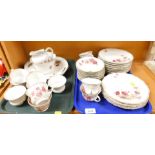 Part tea service decorated with flowers amongst foliage, to include sugar bowl, milk jug, teacup, sa