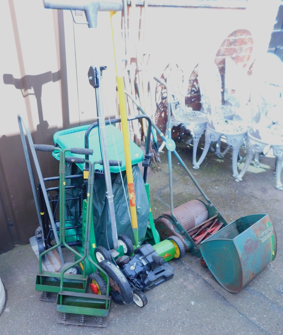 Garden equipment, including a scarifier, various trolleys, Hozelock system, a Qualcast Panther 330DL