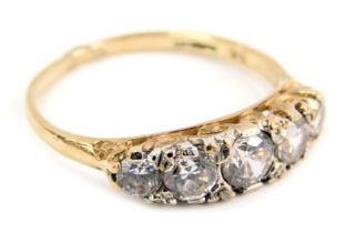 An 18ct gold diamond five stone dress ring, set with five round brilliant cut diamonds of