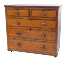 A Victorian oak and cross banded chest, of two short and three long drawers, on castors, 99cm