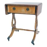 A mahogany drop leaf side table, in Regency style, the top with a moulded edge with frieze drawer,