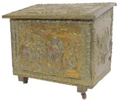A 20thC embossed brass coal box, depicting rural scenes with figures and animals, on castors, 50cm