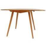 An Ercol elm drop leaf dining table, the top with a rounded edge, raised on square tapering out