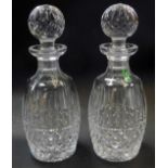 A pair of Waterford crystal Tramore pattern decanters and stoppers, one with paper label, each
