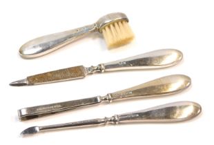 Four George V silver handled manicure implements, Birmingham 1912.