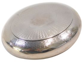 An Edward VII silver tobacco box, of oval form, with engine turned decoration, vacant oval