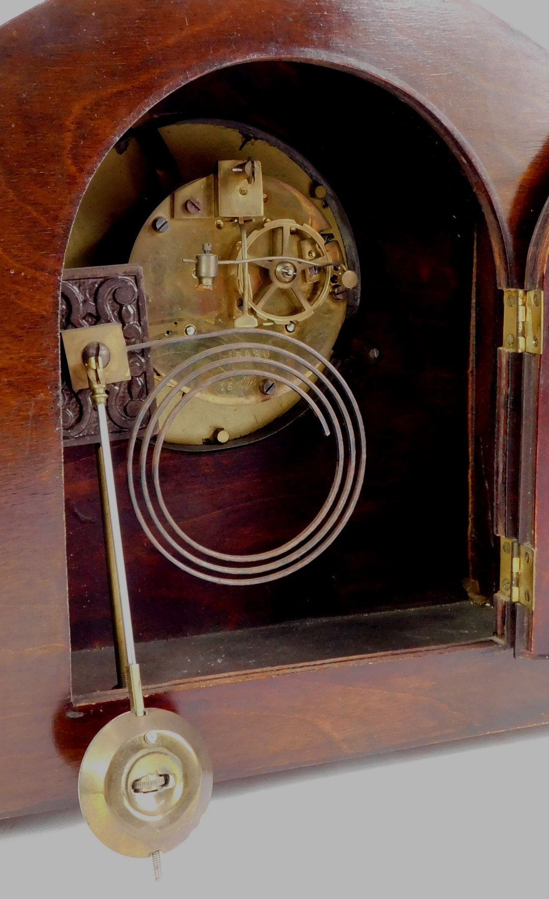 An early 20thC mahogany and inlaid mantel clock, the circular silvered dial bearing Arabic numerals, - Image 3 of 3