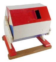 A mid century painted tombola drum, in red, white and blue, with sliding drawer, with a carved horse