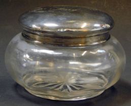 A George V cut glass and silver topped dressing table jar, of large proportions, bearing inscription