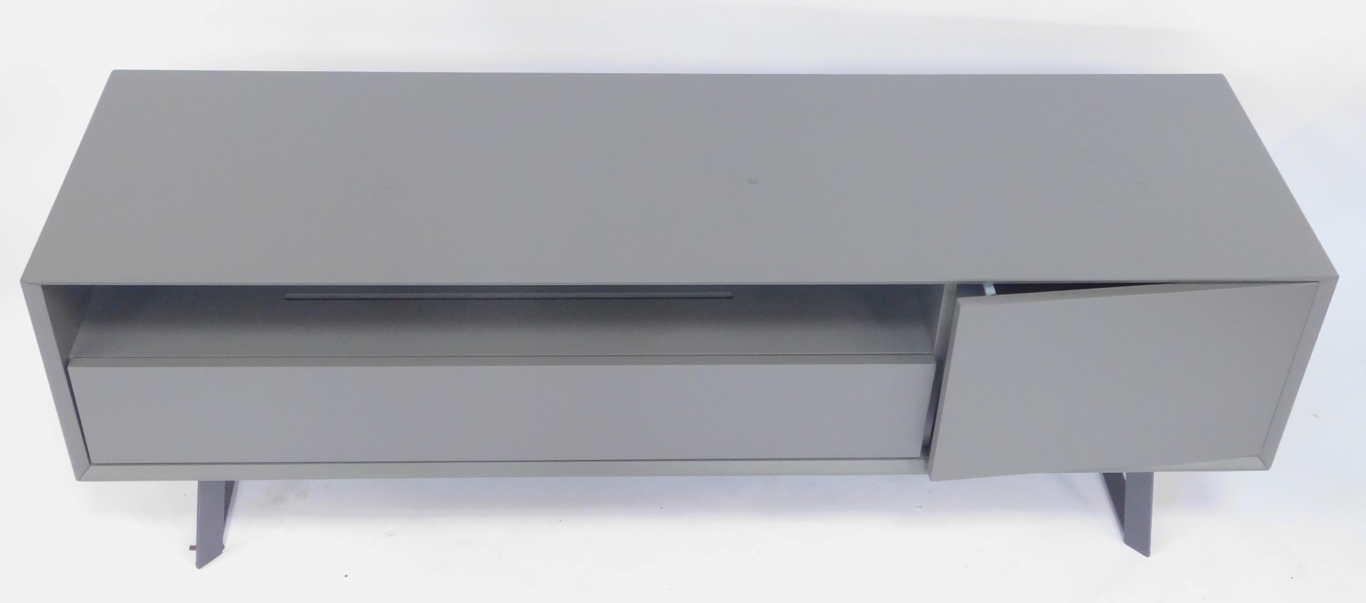 A modern TV unit, in grey, the rectangular top with a recess and drawer beside a cupboard, on - Image 2 of 3