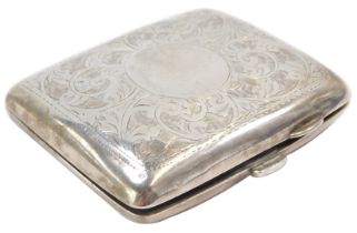 An Edward VII silver cigarette case, with engine engraved floral scroll decoration and a vacant