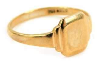 A signet ring, with a rectangular ring head, with canted corners, on stepped shoulders, yellow metal