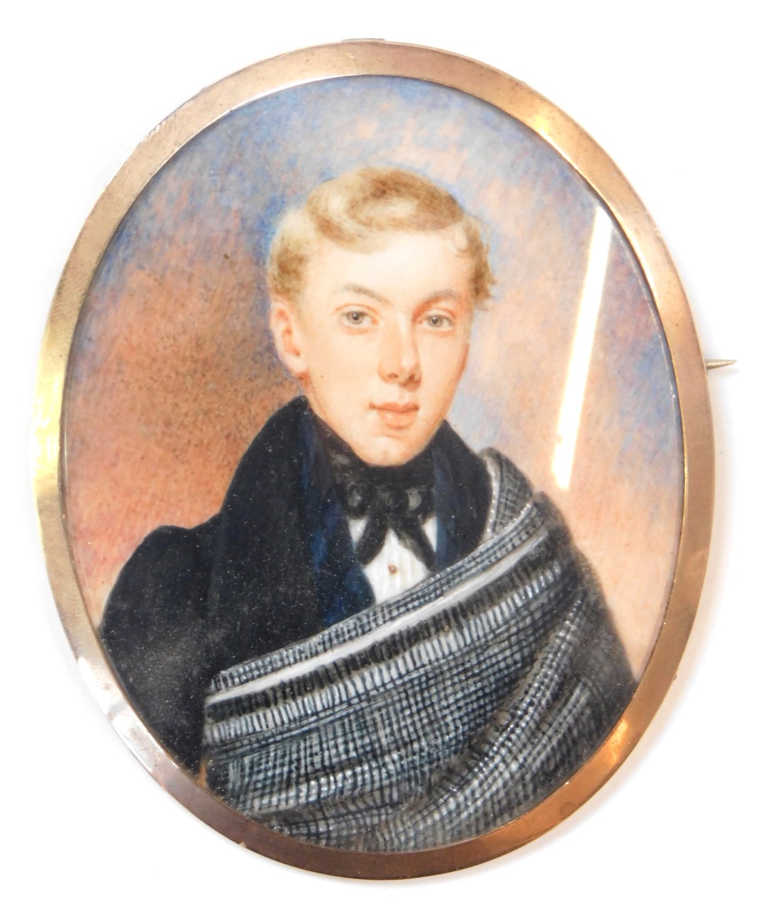 A 19thC portrait brooch, of oval design, the miniature painted oval panel depicting blonde haired