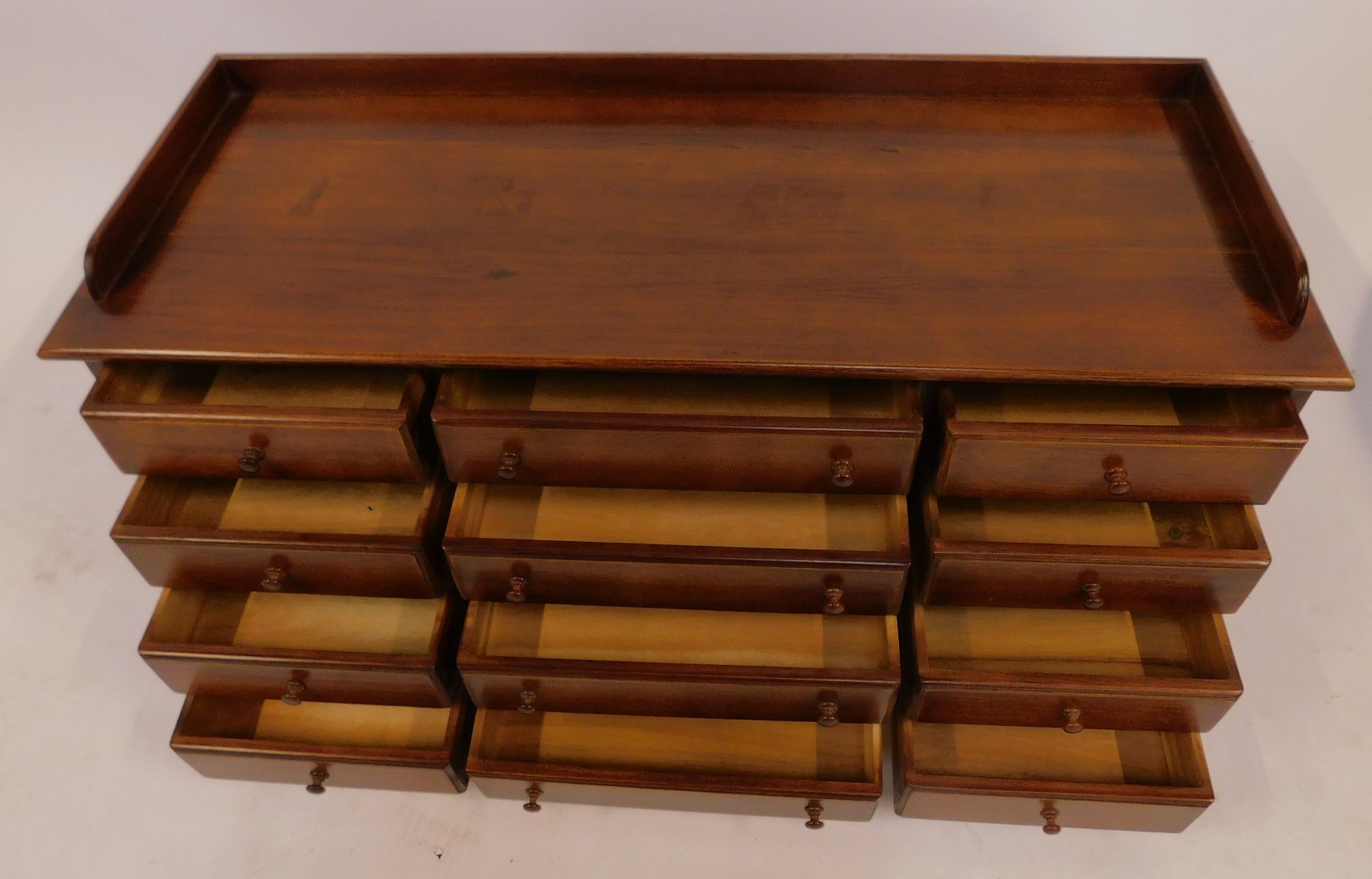 A 20thC mahogany collectors cabinet, the top with a raised back above an arrangement of twelve - Image 3 of 3