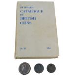 A George III cartwheel penny, two George III pennies, heavily rubbed, and a standard catalogue of