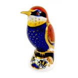 A Royal Crown Derby porcelain bee-eater paperweight, red printed marks and gold stopper, 10cm