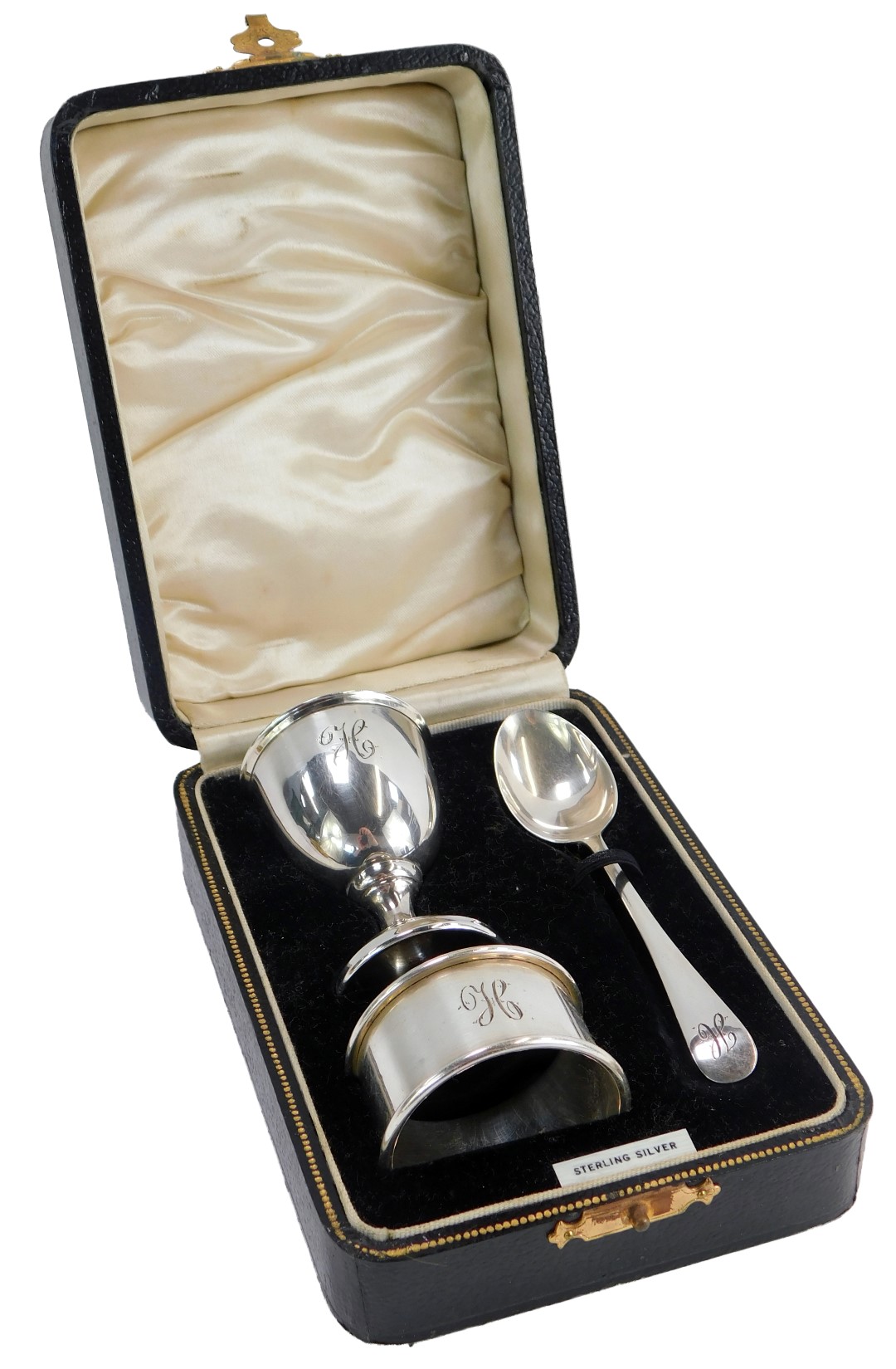 A George VI cased silver Christening set, comprising egg, spoon and napkin rings, each bearing the