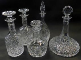 A pair of Stewart crystal cut glass decanters, each of cylindrical form with elongated neck, with