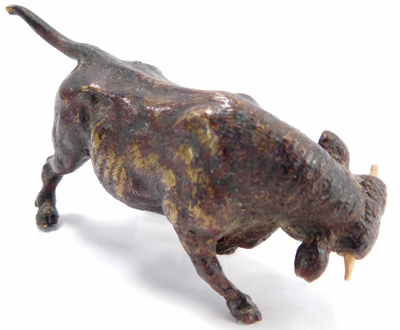 A 19thC bronze figure of a bull, unmarked, with later wooden horns, 10cm wide. - Image 2 of 2