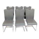 A set of six modern dining chairs, each with a grey leatherette seat and back, with cream stitching,