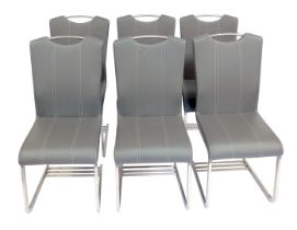 A set of six modern dining chairs, each with a grey leatherette seat and back, with cream stitching,
