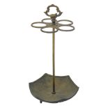 A 20thC cast iron umbrella stand, modelled as an upturned umbrella with five ring sections for