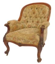 A Victorian walnut framed armchair, with curved button back, overstuffed scroll arms and seats, with