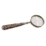 A Chinese magnifying glass, with a white metal dragon carved handle, with stainless steel framed