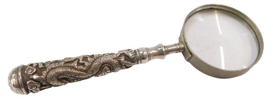 A Chinese magnifying glass, with a white metal dragon carved handle, with stainless steel framed