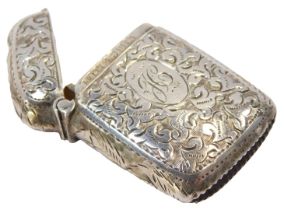 A Victorian silver Vesta case, with engraved foliate decoration, oval reserve, initial engraved,