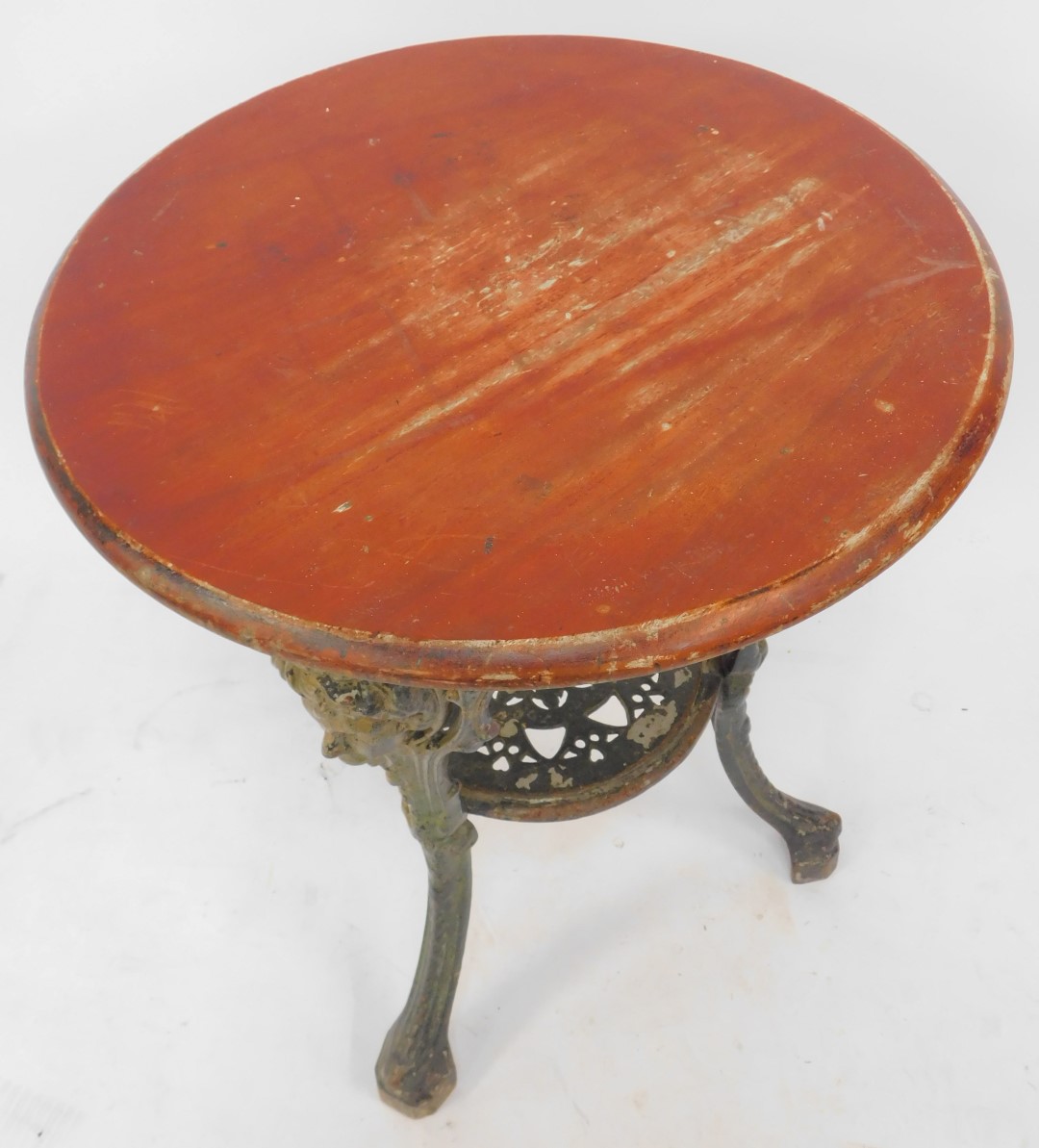 An early 20thC pub table, the stained oak top above a cast iron base decorated with masks, - Image 2 of 3