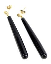 A pair of imitation jet drop earrings, each on single pin back with butterfly back, yellow metal