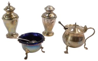 An Edward VII and later four piece matched silver cruet set, comprising salt and pepper pot,
