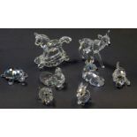 A group of Swarovski crystal figures, comprising rocking horse, standing deer and seated deer,
