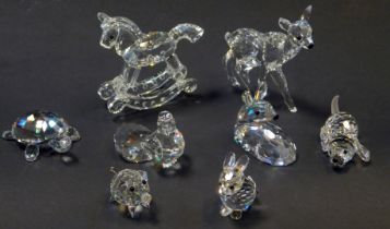 A group of Swarovski crystal figures, comprising rocking horse, standing deer and seated deer,