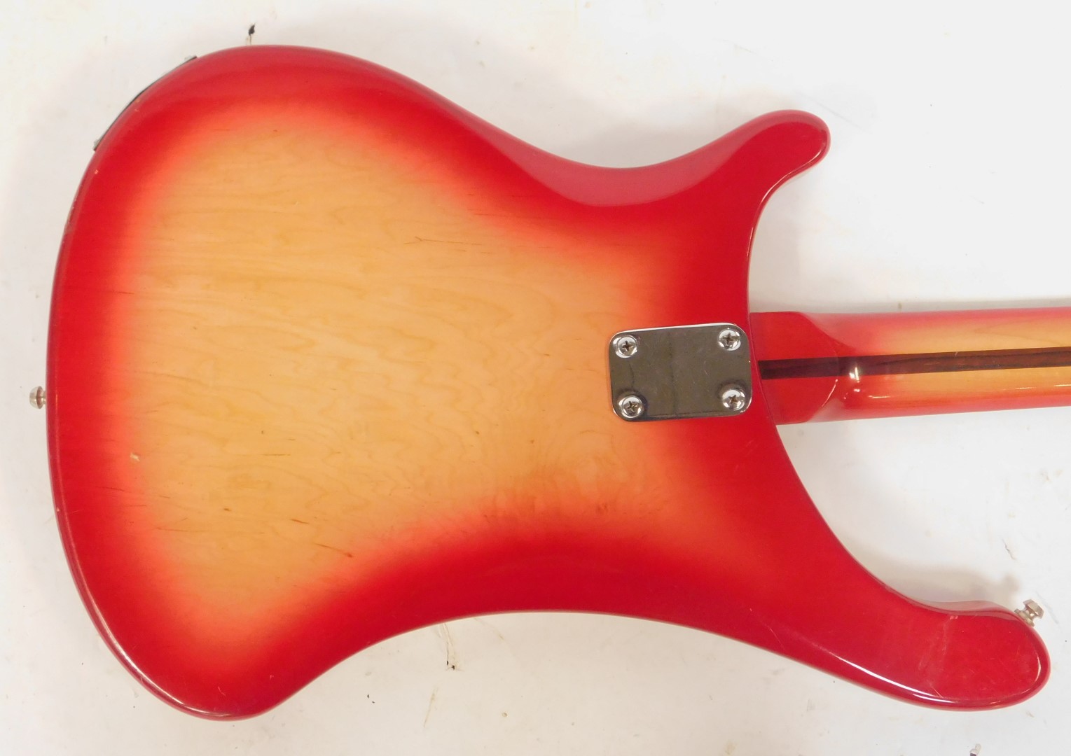 A Rirkenbacker electric bass guitar, the body in red, with the front panel fading to a yellow, the - Image 3 of 7