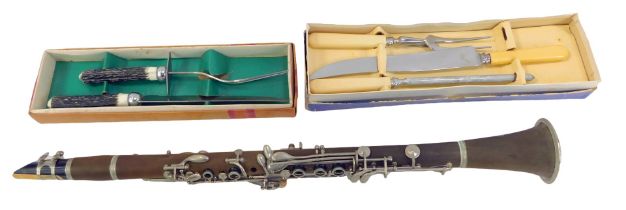 A Krugerstein clarinet, together with two carving sets.