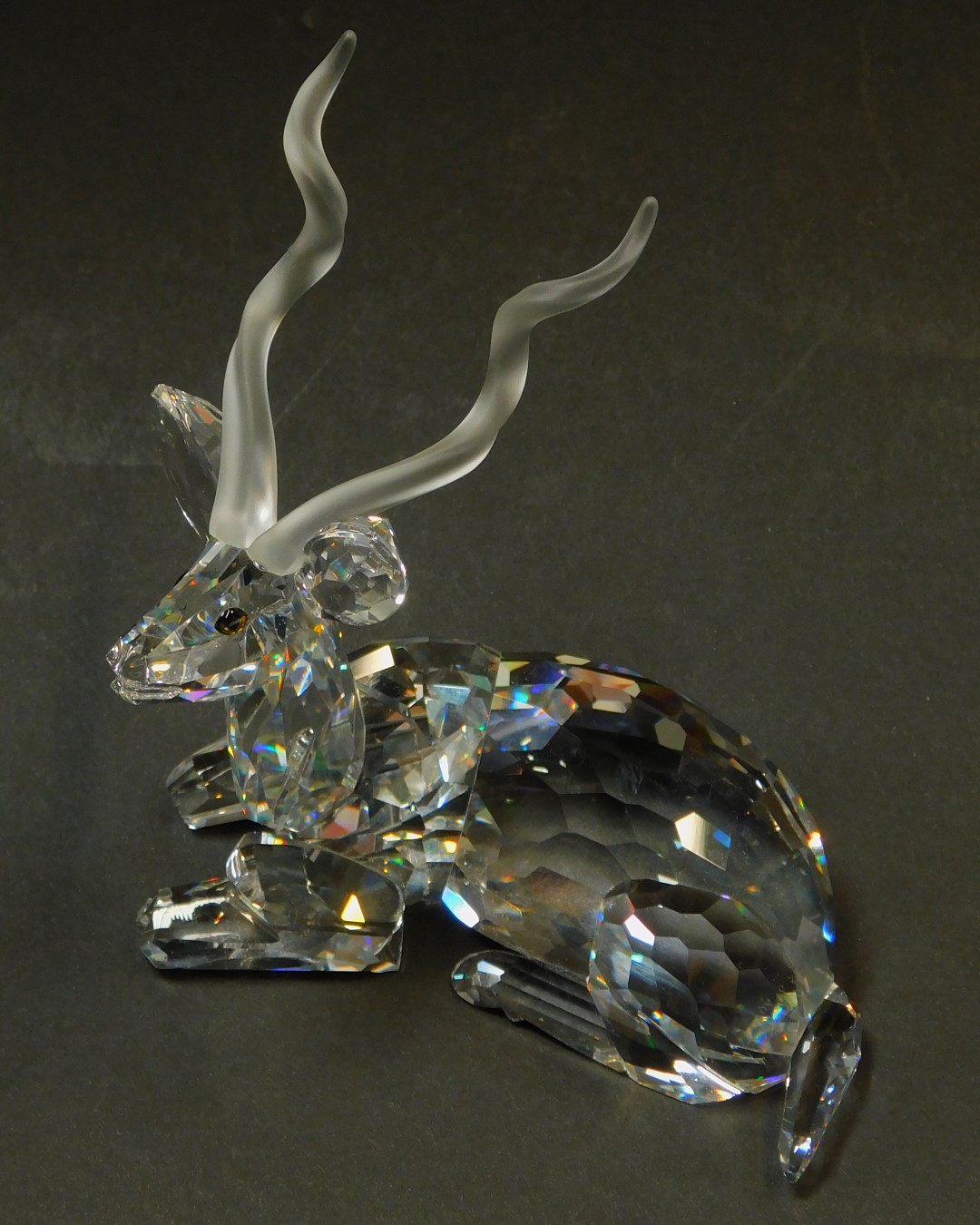 A Swarovski crystal figure modelled as a seated antelope, 12cm high. - Image 2 of 3