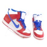 A pair of Nike Dunk trainers, in red and blue, size UK 7.5.