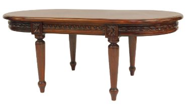 A 20thC mahogany coffee table, the oval top above a flower head and repeat twist pattern edge, on