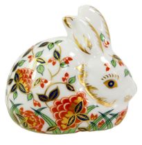 A Royal Crown Derby porcelain meadow rabbit paperweight, an exclusive for the Royal Crown Derby