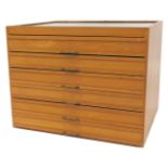 A beech tabletop haberdashery cabinet, the top with a glass panel, base with six drawers, each