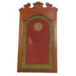 An Edwardian WWI Death plaque or penny walnut frame, the top with carved decoration above a shaped