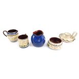 A group of Torquay ware, comprising mug, jug, circular dish, 12cm diameter, vase, blue glazed vase