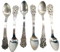 A set of six white metal teaspoons, each with a pierced flower top stamped L900, 2.08oz.