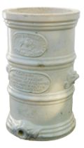 A stoneware water filter, stamped Her Majesty's Royal Letters, on cream finish with lion mask