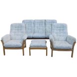 An Ercol elm framed Saville suite, comprising three seater sofa, a pair of armchairs, and a